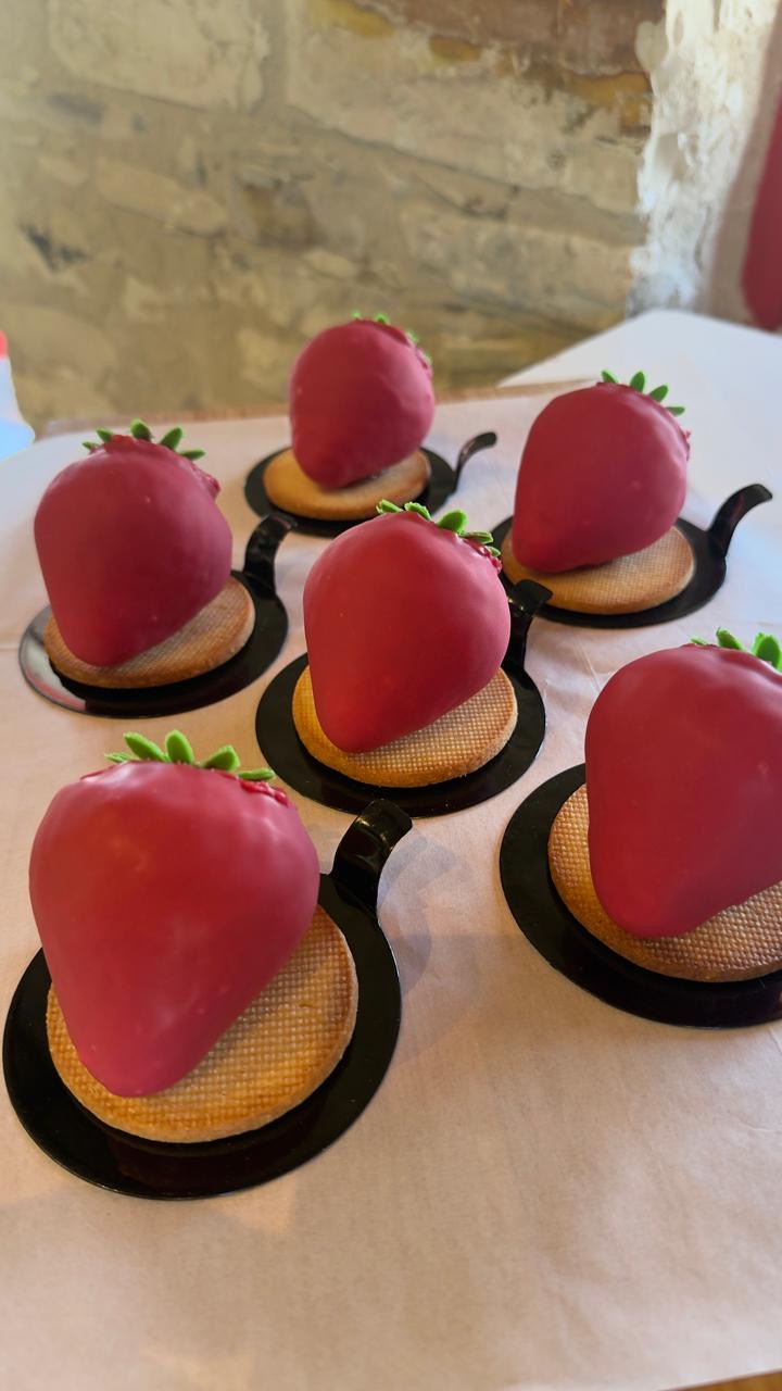 Strawberry desserts on the stone-walled counter at December9
