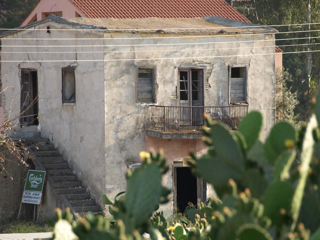 Old stone house before restoration, front view